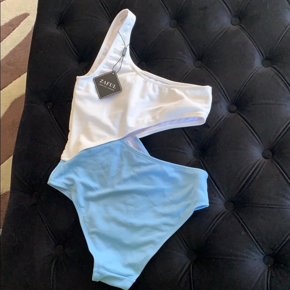 White and blue one piece bathing suit.